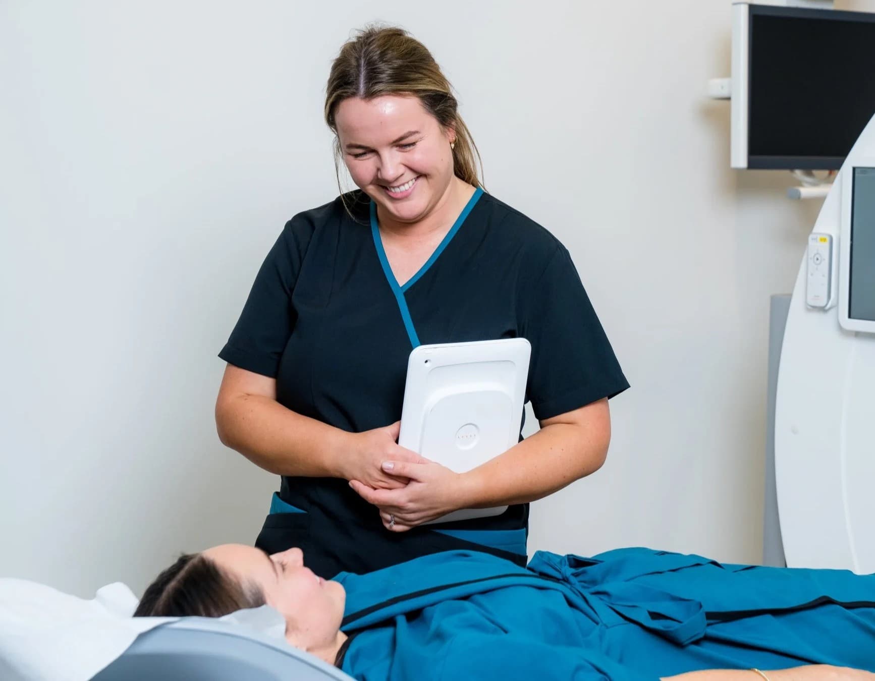 Smiling MRI nurse discussing with patient
